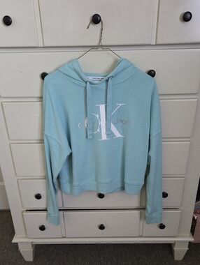 Calvin Klein Jeans Cropped Light Blue Hoodie with White CK Logo